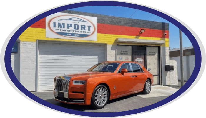 Rolls-Royce luxury sedan parked outside Import Car Specialists shop