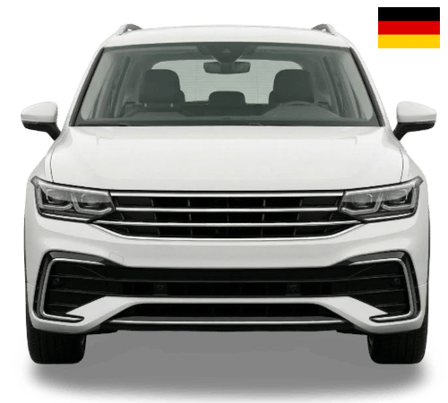 A white Volkswagen Tiguan SUV viewed from the front, with the German flag in the top right corner.