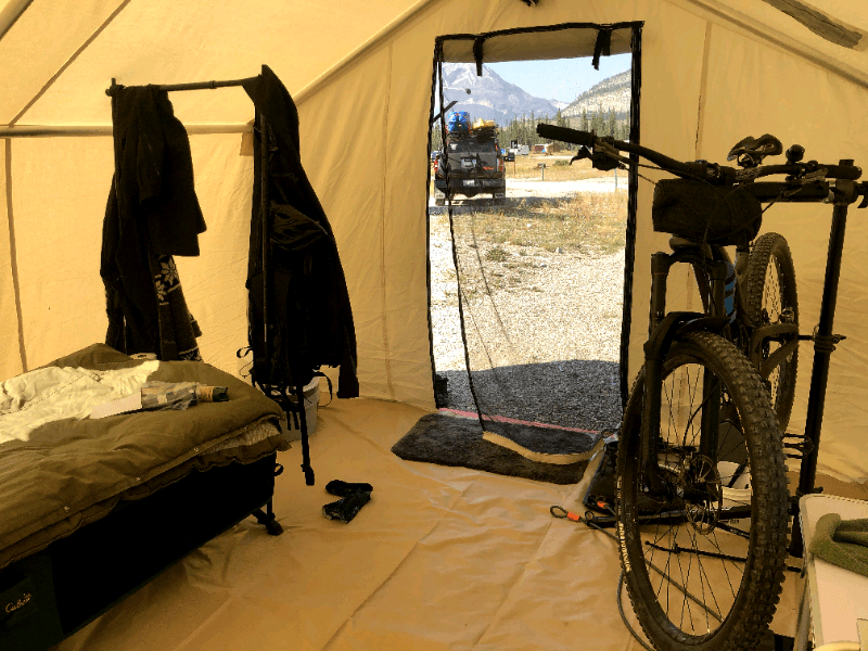 A tent with a bicycle inside of it