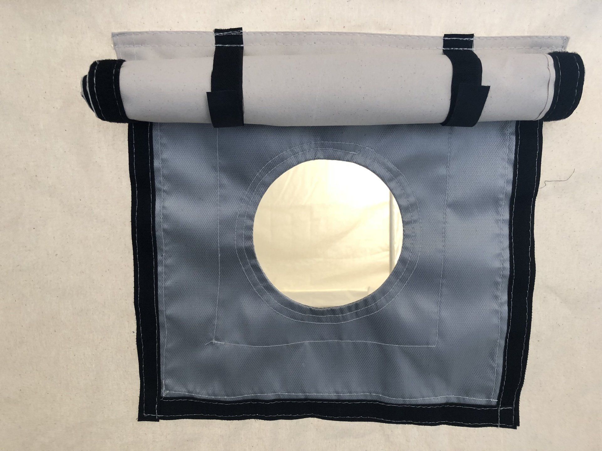 A piece of fabric with a hole in the middle of it