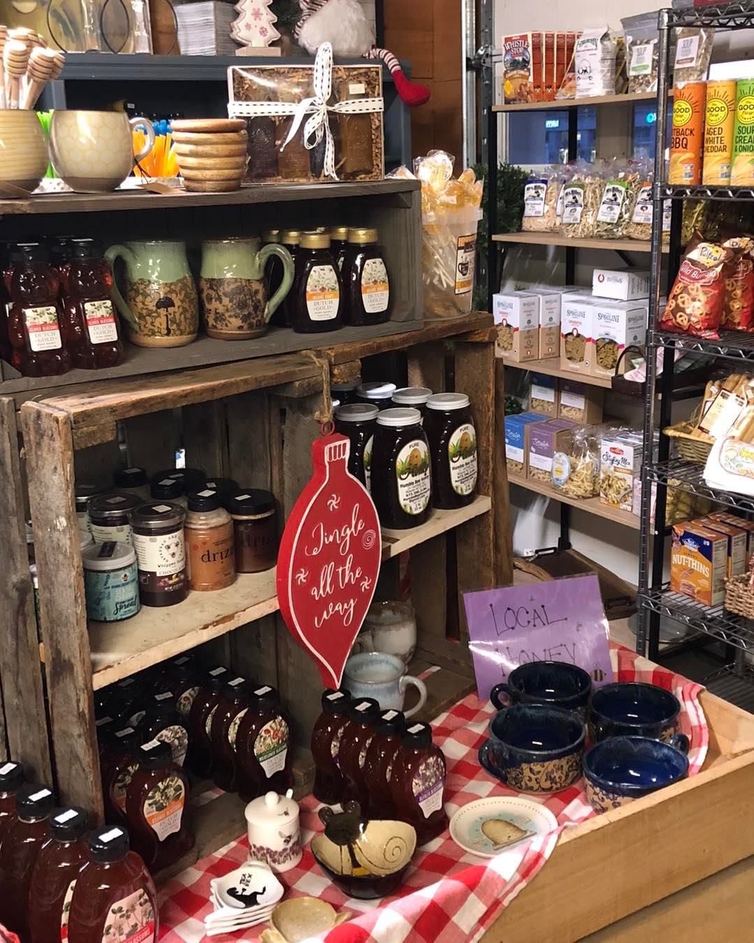 A store filled with lots of jars and cups on shelves.