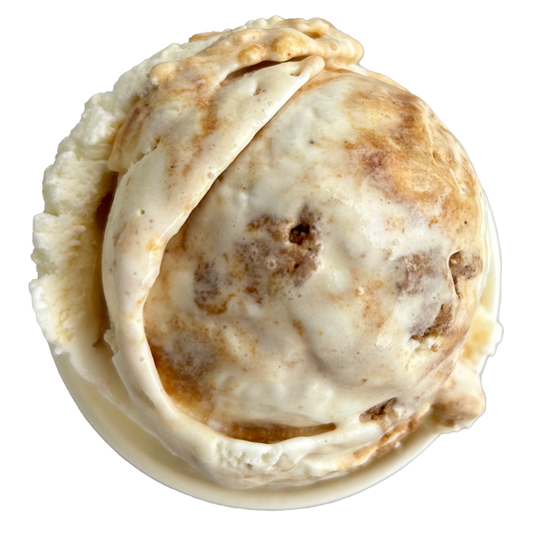 Scoop of ice cream with brown swirls and pieces, in a small white dish.