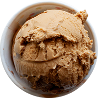 A close up of a scoop of ice cream in a bowl