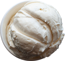 A scoop of vanilla ice cream in a paper cup