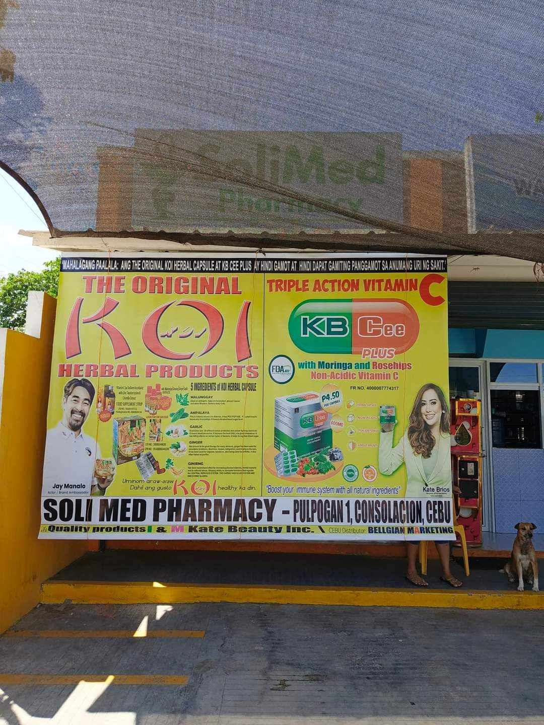 A yellow sign that says ' the original koi herbal products ' on it