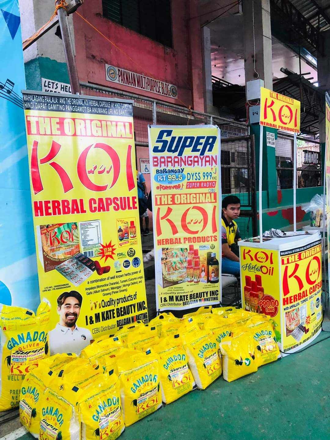 A bunch of yellow bags are sitting in front of a building.
