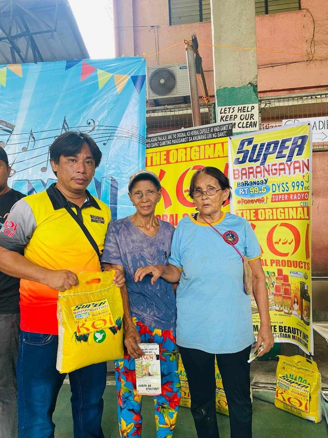 A group of people standing next to each other in front of a sign that says super.