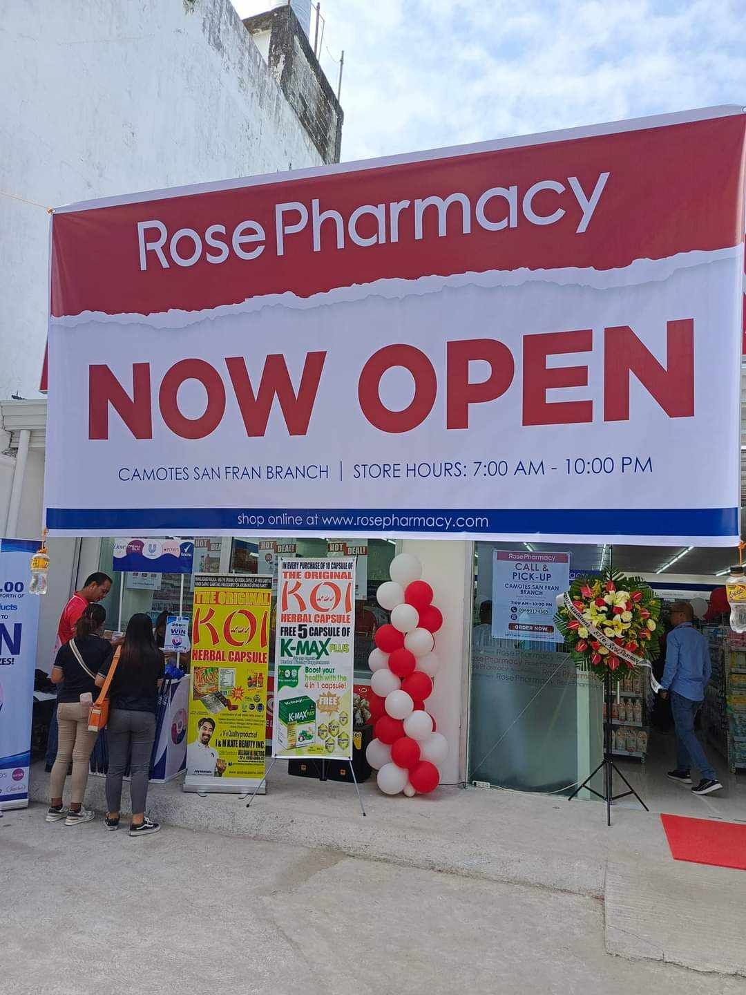 A Rose Pharmacy is now open with balloons in front of it