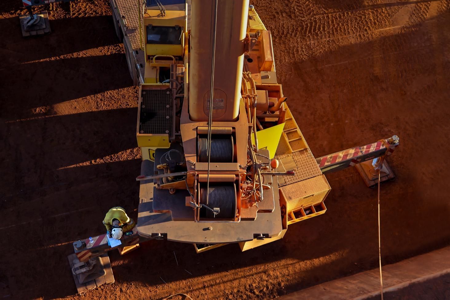 An Aerial View of a Construction Site With a Large Yellow Crane — Smithys Crane Hire in Trinity Beach, QLD