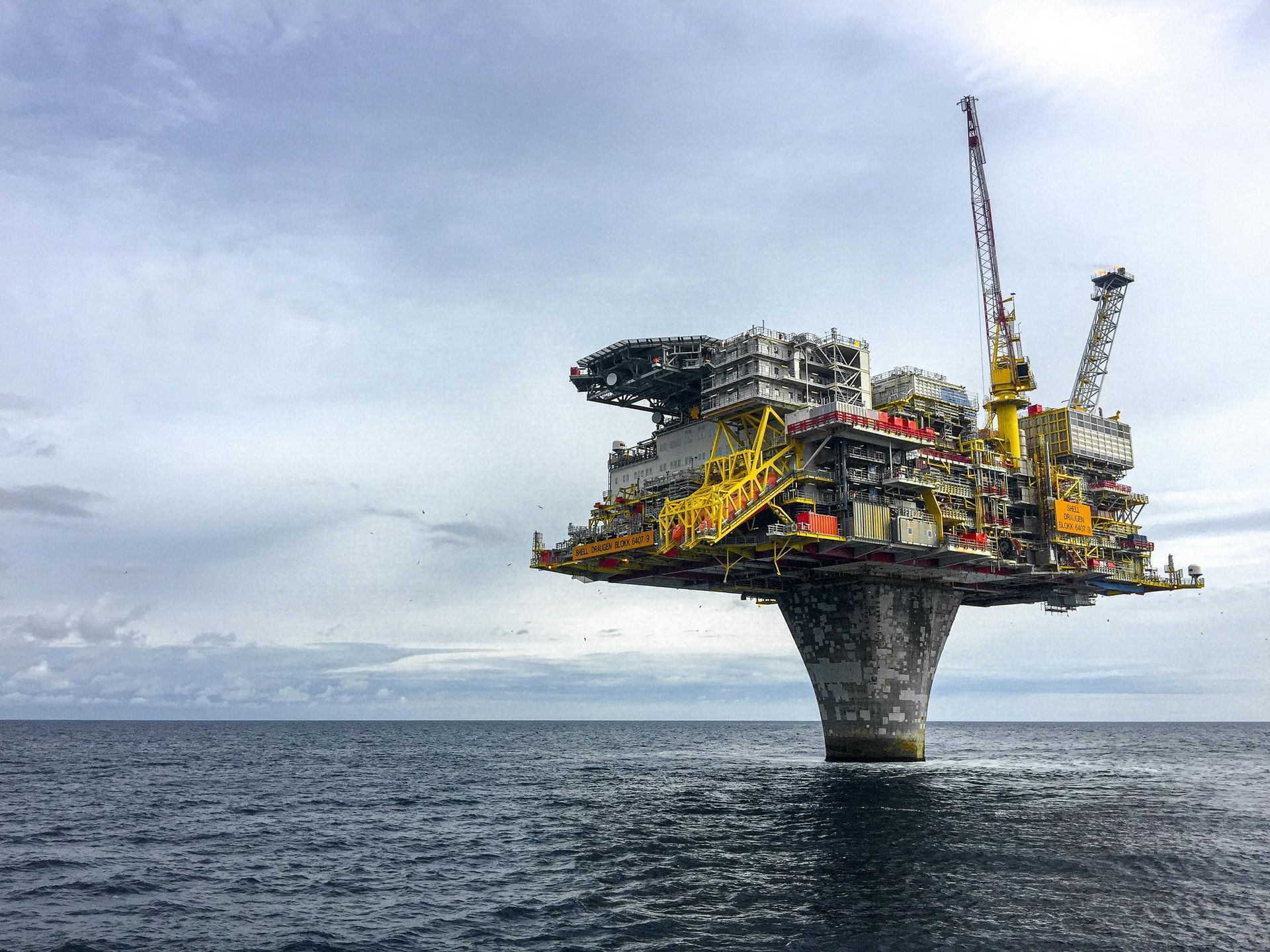 A large ship is floating on top of a body of water.