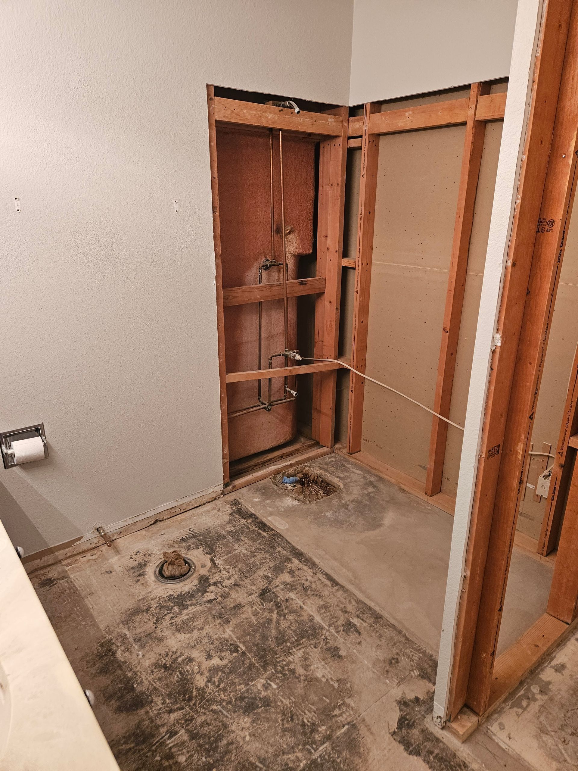 A bathroom is being remodeled and the wall is being removed.