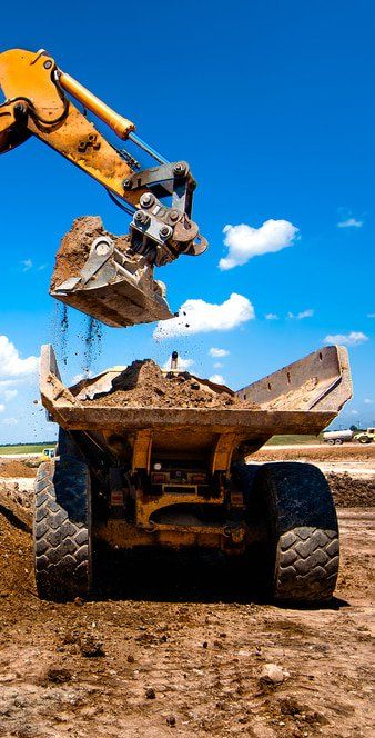Loading Soil to a Truck — Copp & Co Civil & Plant Hire in Cannonvale, QLD