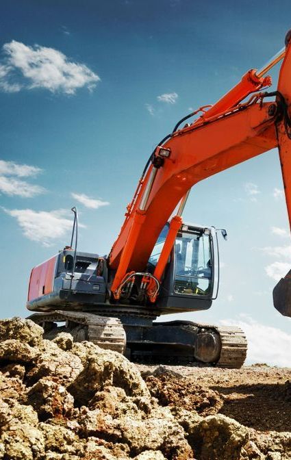 A Large Orange Excavator is Working on a Pile of Rocks — Copp & Co Civil & Plant Hire in Cannonvale, QLD