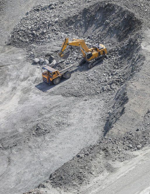 Collecting Ore — Copp & Co Civil & Plant Hire in Airlie Beach, QLD