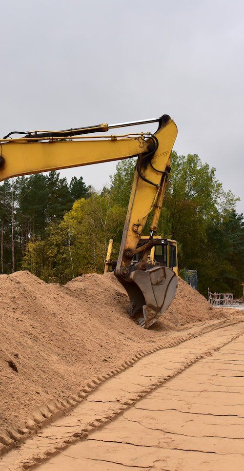Yellow Backhoe — Copp & Co Civil & Plant Hire in Mount Julian, QLD