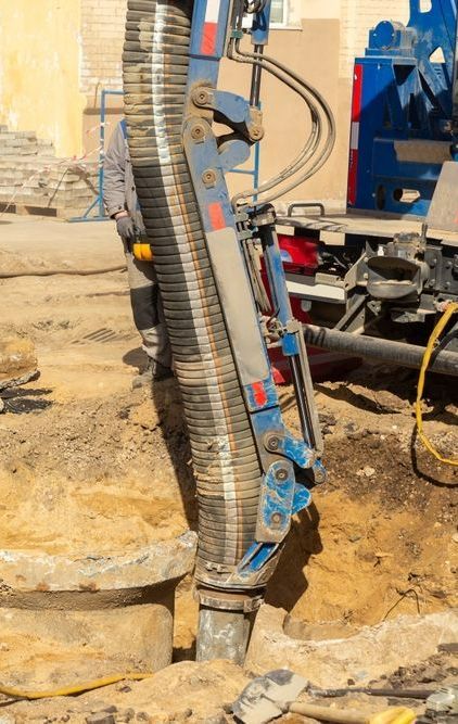 A Close Up of a Hose Attached to a Machine on a Construction Site — Copp & Co Civil & Plant Hire in Proserpine, QLD