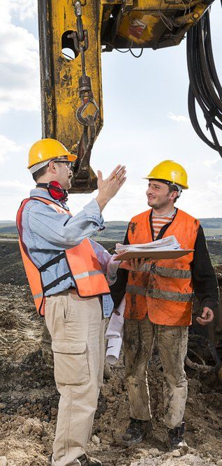 Engineer Directs Construction Worker — Copp & Co Civil & Plant Hire in Bowen, QLD