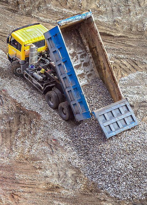 Unloading Rubble — Copp & Co Civil & Plant Hire in Mount Julian, QLD