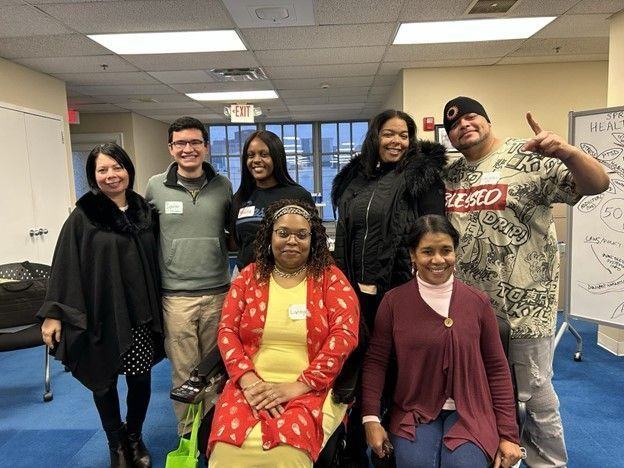 Group of resident advocates posing for a photo after a health equity training.