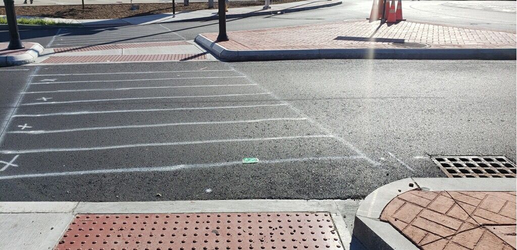 Crosswalk marked for painting on newly paved road