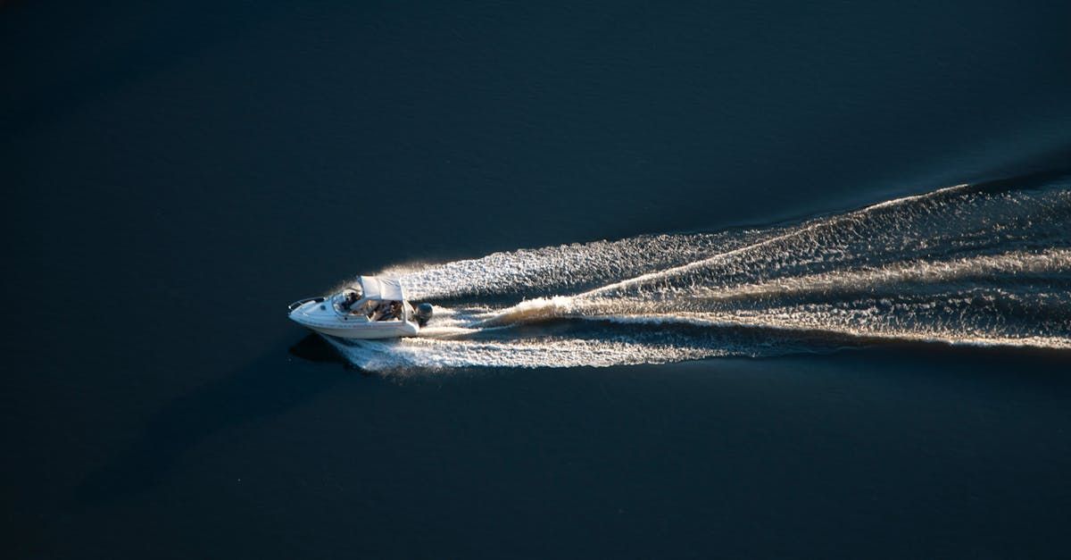 A boat is floating on top of a body of water.