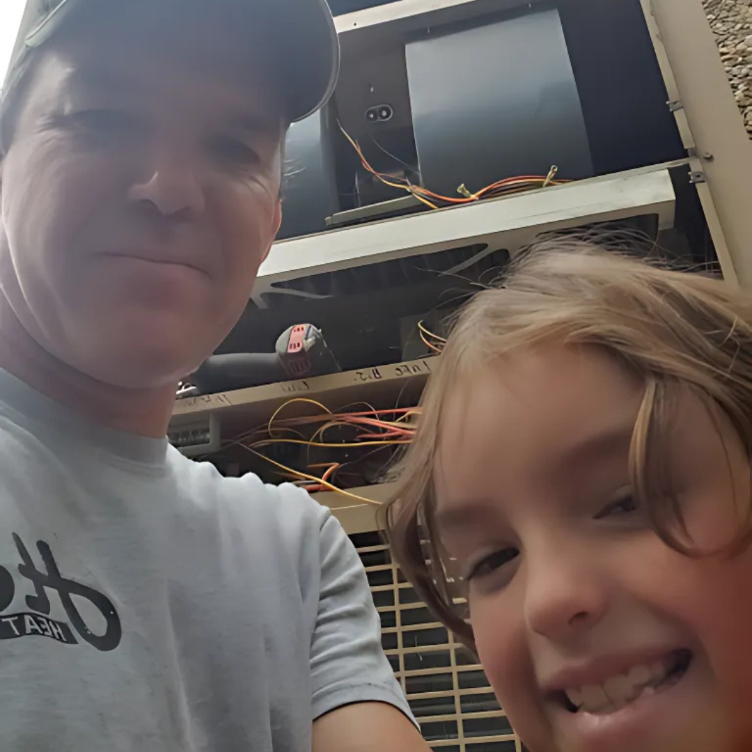 A man and a little girl are posing for a picture and the man is wearing a shirt with the letter b on it