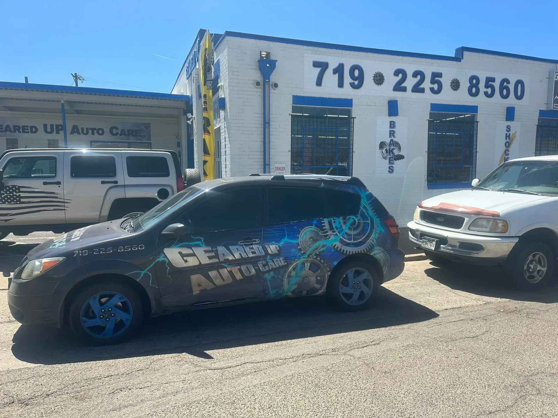 A car with a shop sign, 