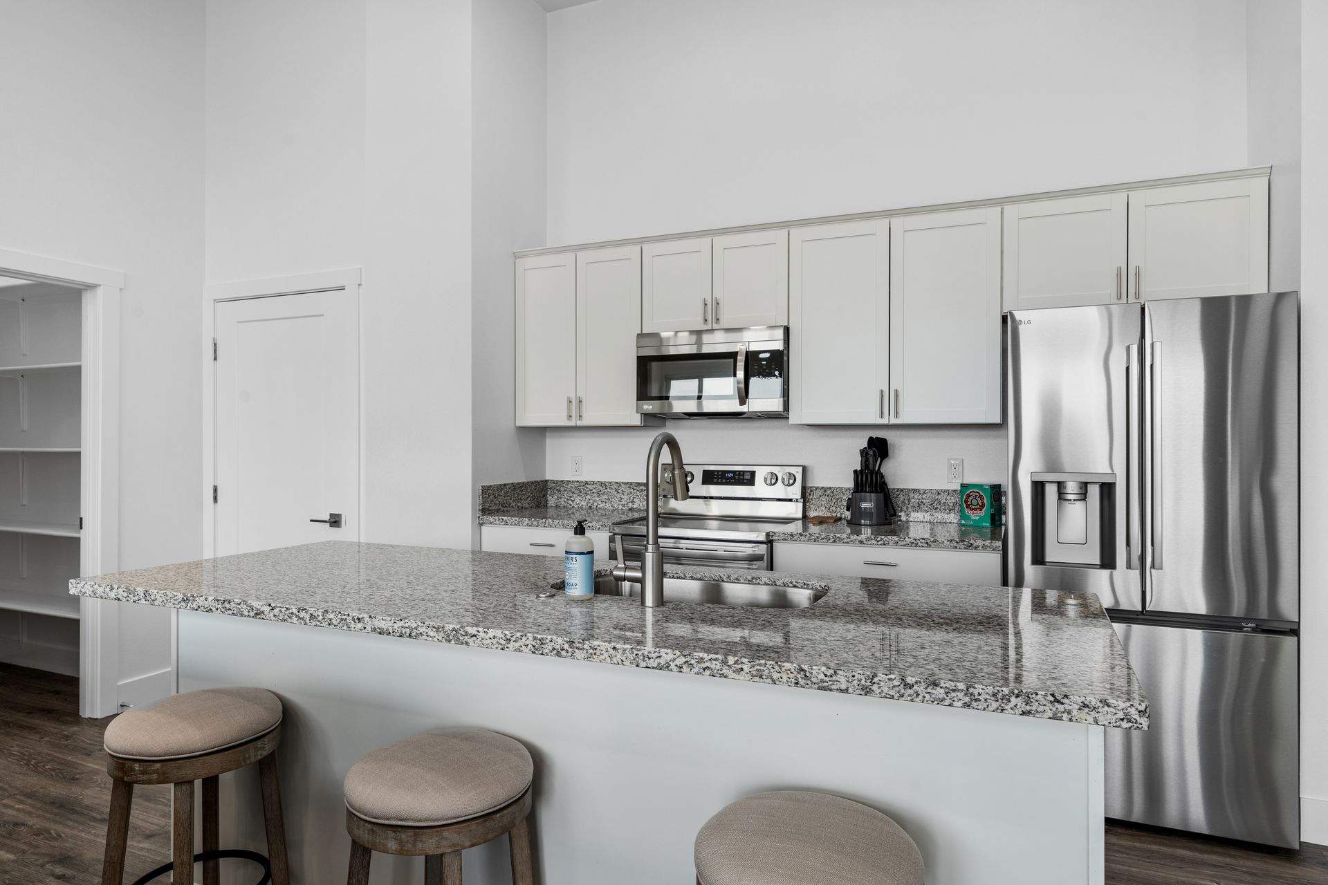 A kitchen with stainless steel appliances and granite counter tops