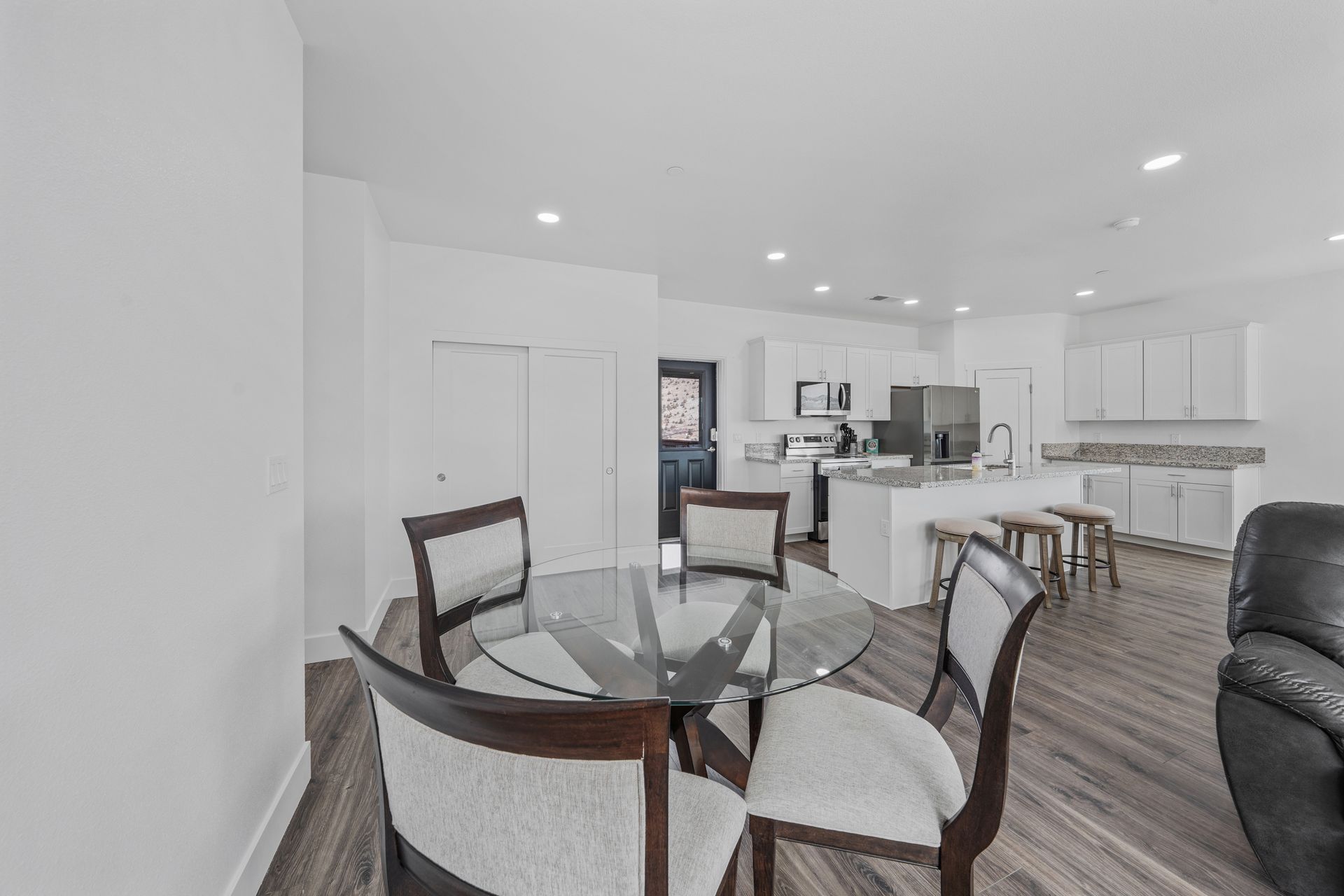 There is a dining table and chairs in the middle of the room.