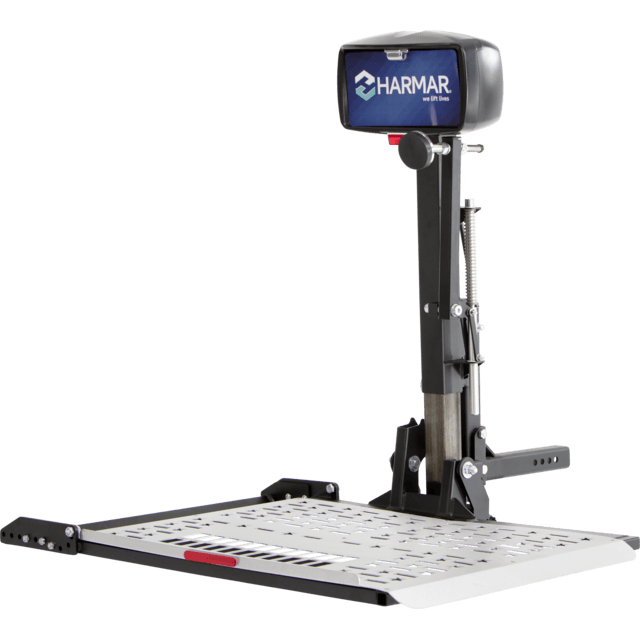 A Harmar mobility scooter lift, black and gray, with a platform and control panel.