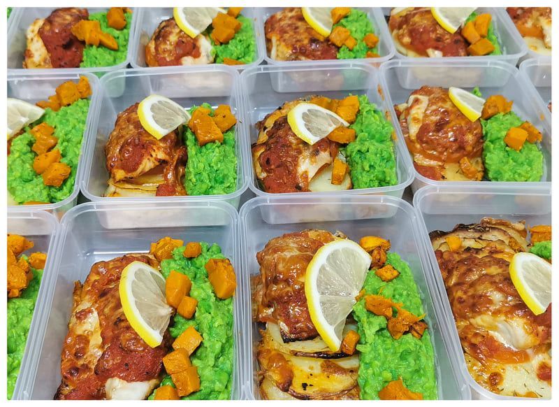 Meal Prep Containers, Each With Chicken, Green Mash, and Lemon Slices — Chefs2Go in Cairns, QLD