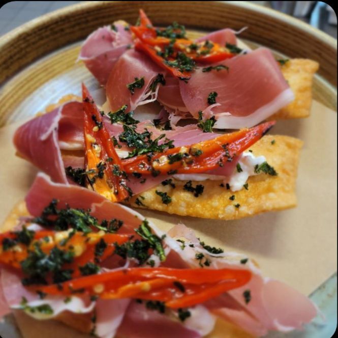 Three fried dough appetizers topped with prosciutto, cheese, red chili peppers, and herbs— Chefs2Go in Whitsunday, QLD