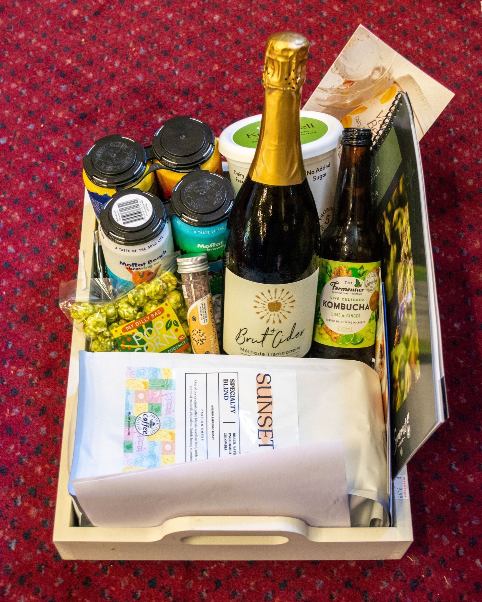 Gift Basket Filled With Various Food and Drinks, Including a Bottle of Champagne — Chefs2Go in Woodwark, QLD