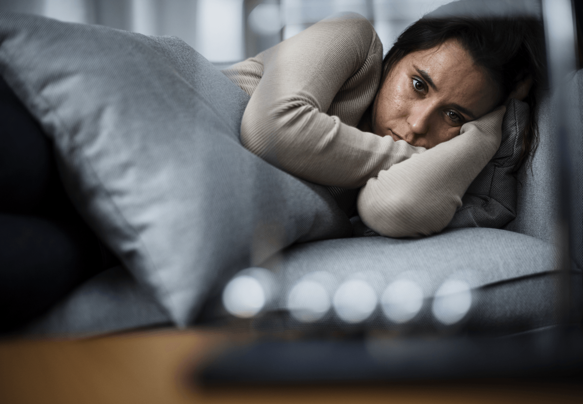 Woman in bed depressed.