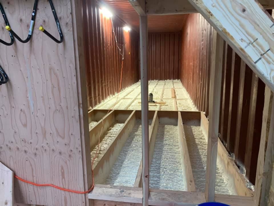 A wooden structure with a staircase leading up to it