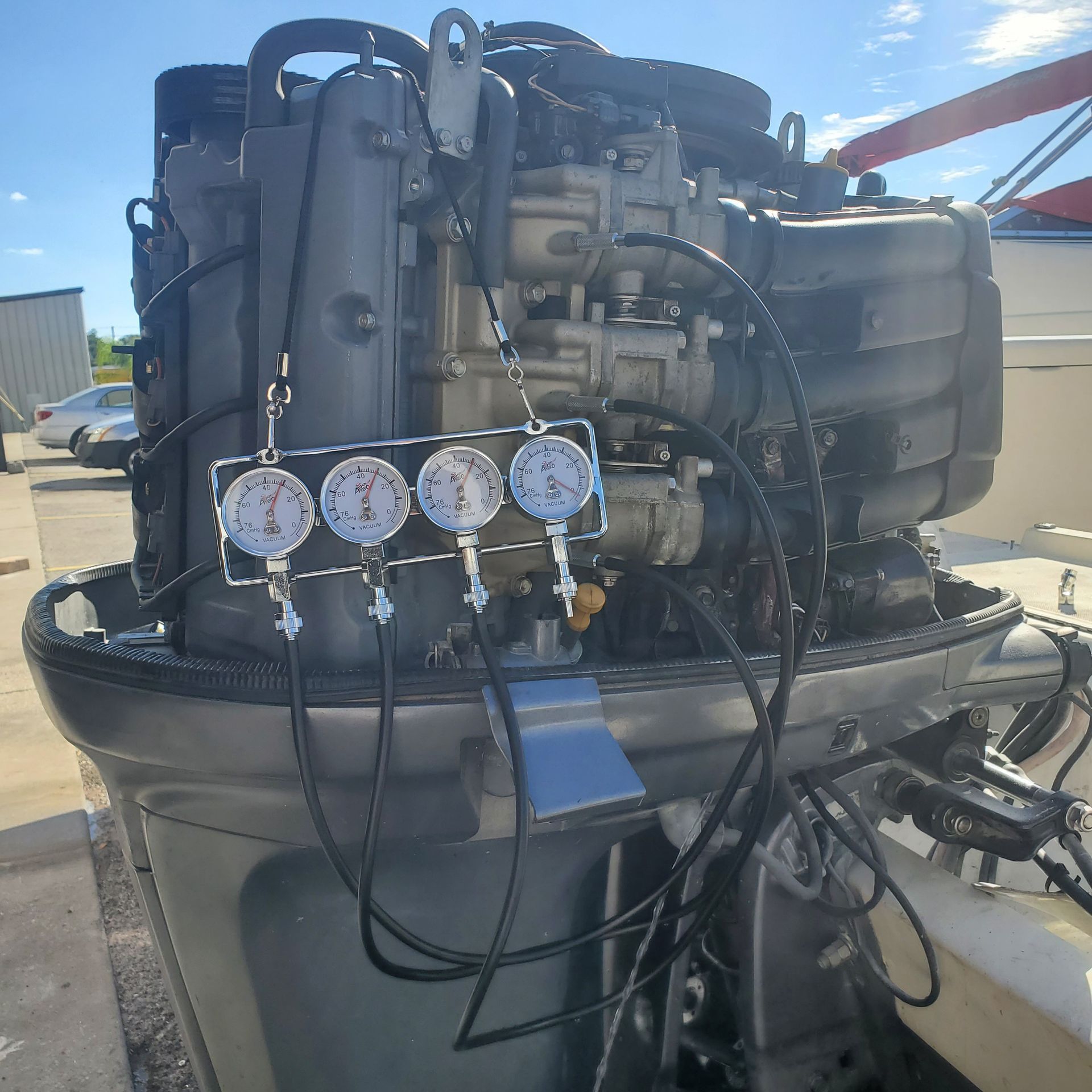 A boat engine with pressure controllers attached to it.