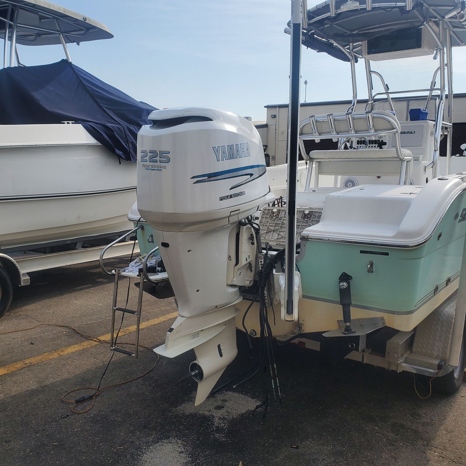 A yamaha outboard motor is attached to the back of a boat