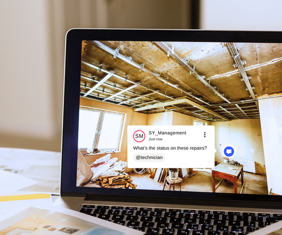 A laptop with a picture of a room on the screen