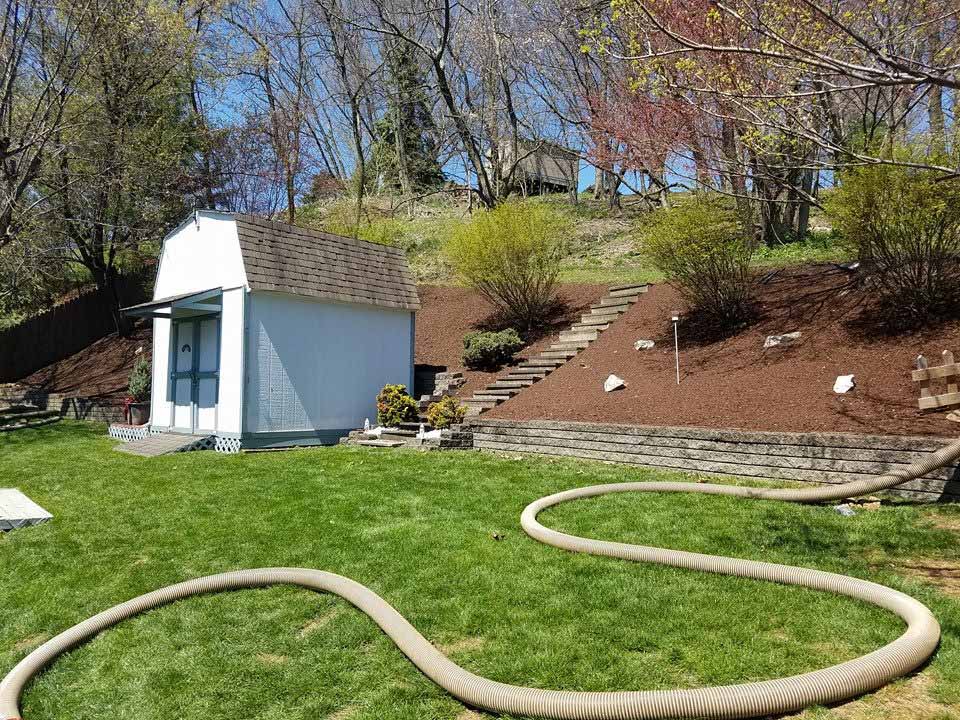 Landscaping – Garden with Small House and a Hose in Jefferson Hills, PA