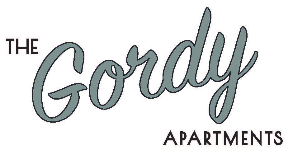 The logo for "The Gordy Apartments" featuring the word "Gordy" in a grey, cursive script above the word "APARTMENTS".