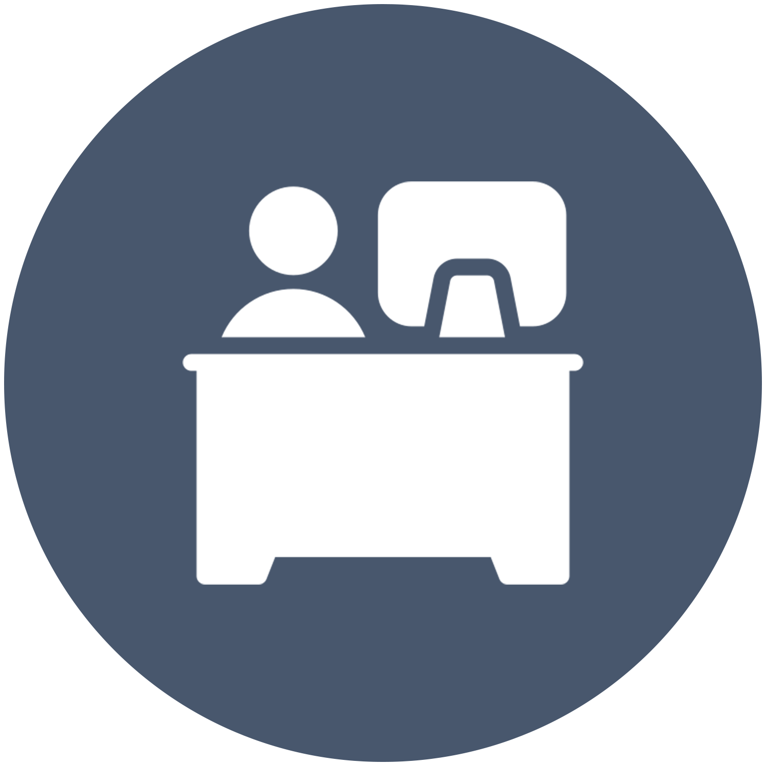Two people are sitting at a desk with a computer.