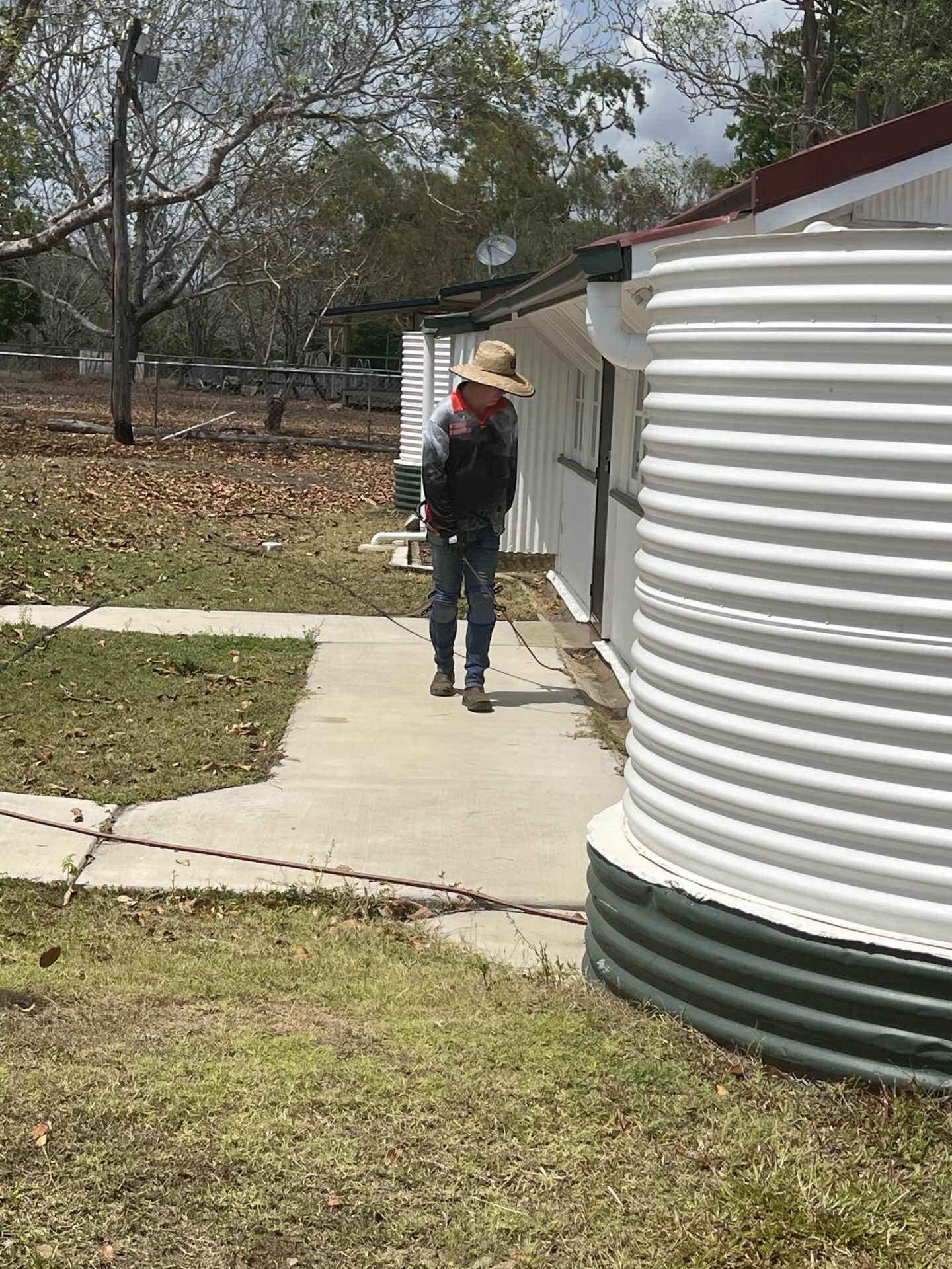 Pest Control Specialist In Hazmat Contractor Working Floor — Pest Control in Atherton, QLD
