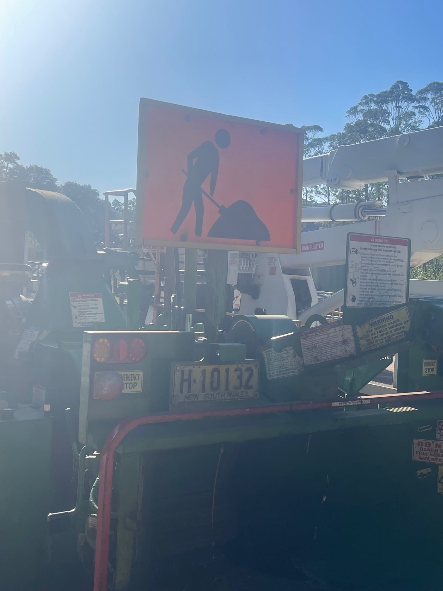 Sign On The Back Of A Truck That Says Under Construction — Mike's Tree Services In  Saint Georges Basin, NSW