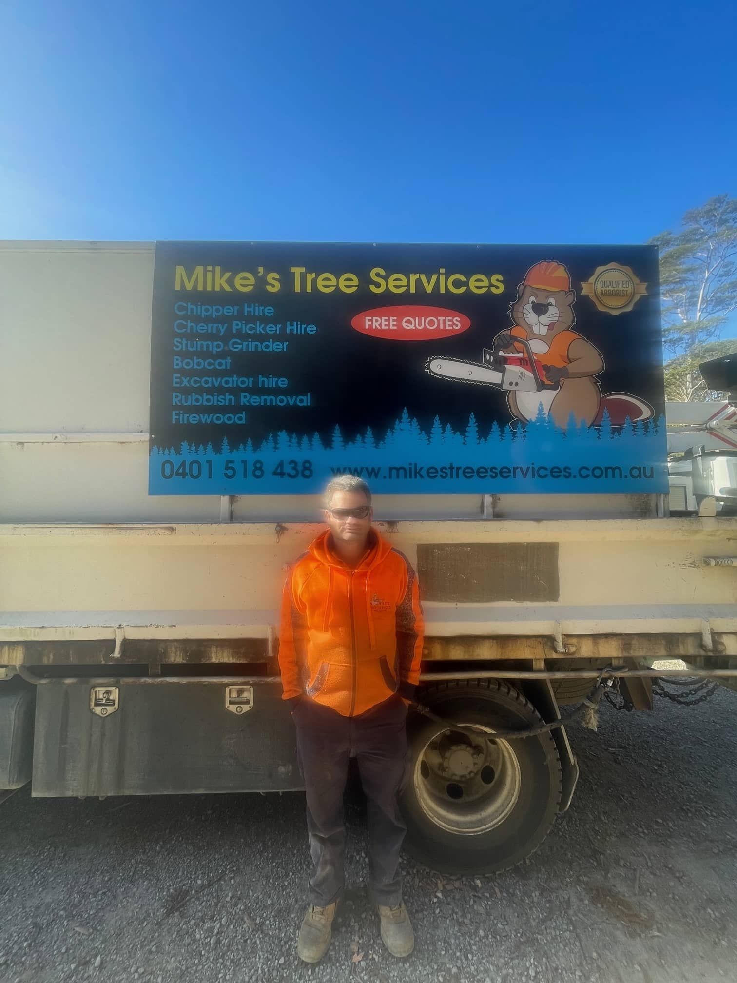 Man Standing In Front Of A Truck That Says Mike's Tree Services — Mike's Tree Services In Sanctuary Point, NSW