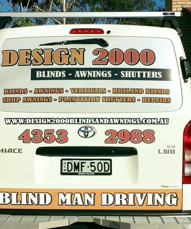 A White Van With Blind Man Driving Written on the Back — Design 2000 Blinds & Awnings In San Remo, NSW