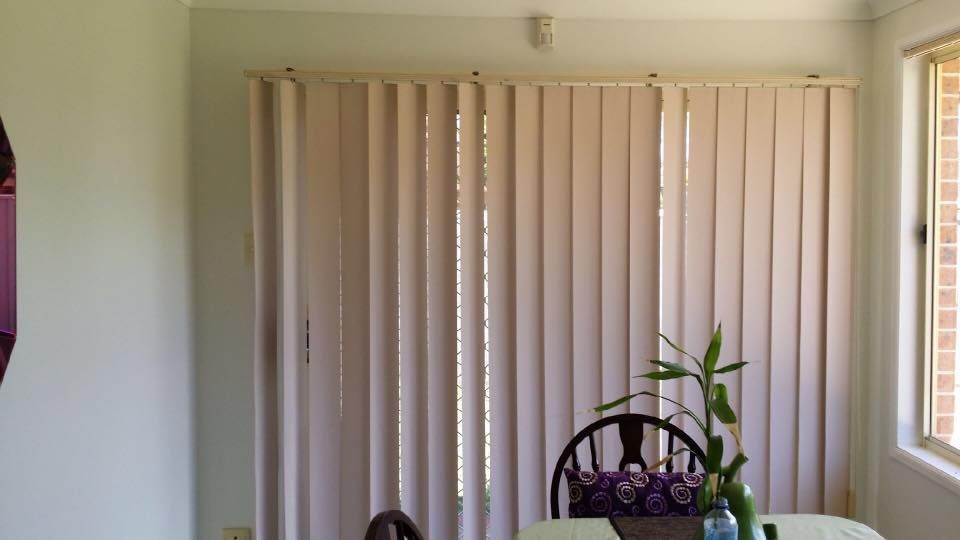 A Dining Room With a Table and Chairs and Blinds on the Windows — Design 2000 Blinds & Awnings In San Remo, NSW