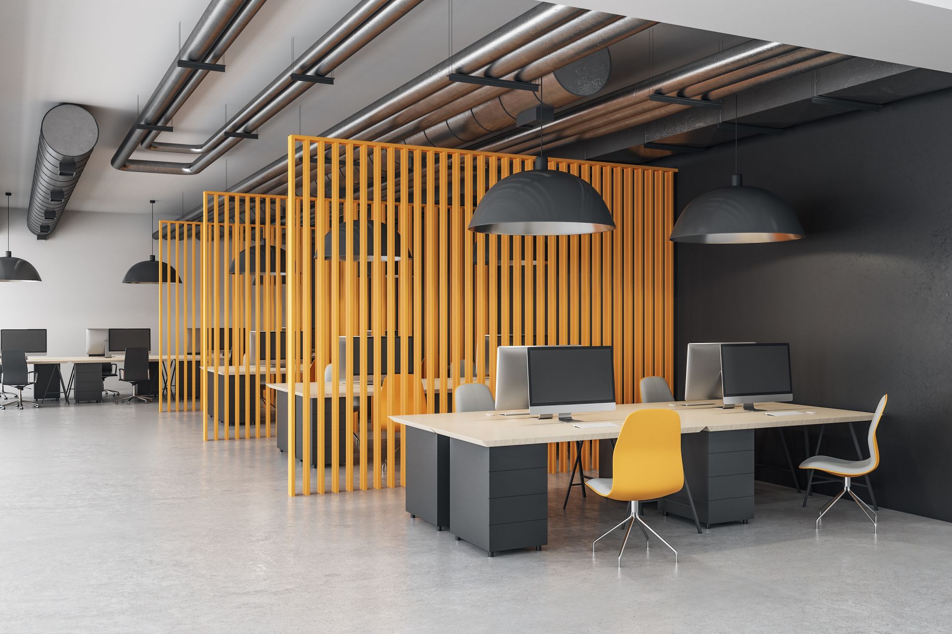 A modern office with a wooden divider between the desks and chairs.