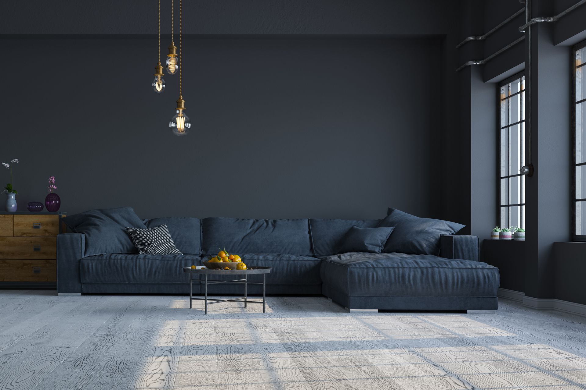 A living room with dark blue walls , a blue sectional couch , a coffee table and two windows.