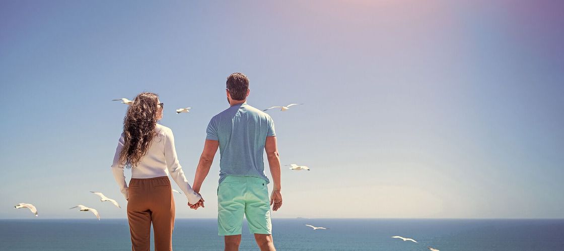 A couple holds hands on the beach after reconnecting at an intimacy workshop in Orlando, FL. Attend one of couples retreat and be the change you want to see in your relationship. Available in Florida, Georgia, South Carolina and beyond.