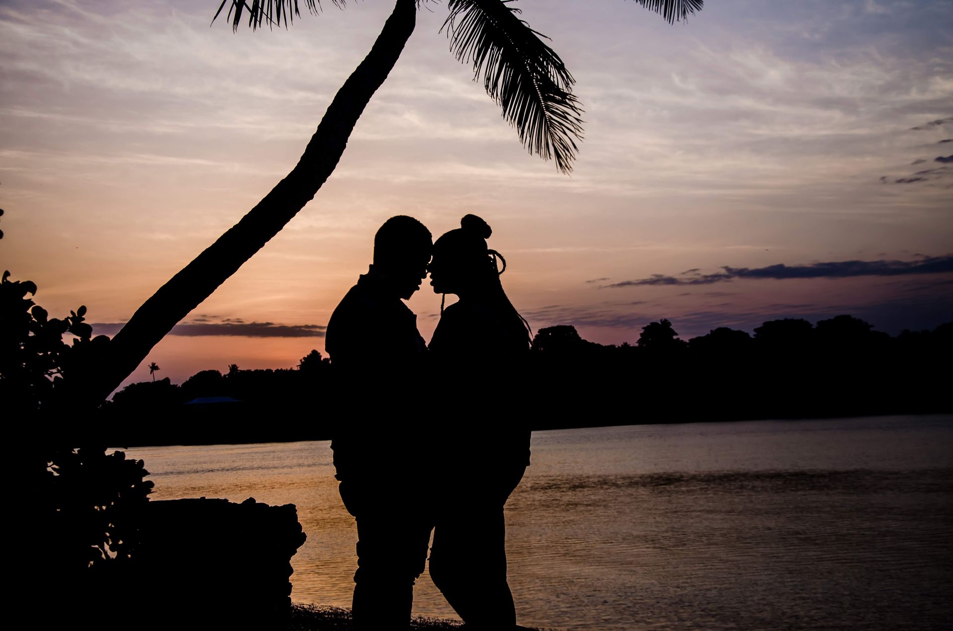 A couple stands face to face on the beach at sunset rejuvenated after a Retreat for Couples in Orlando, FL. Couples Retreats are offered for everyone in Florida, Alabama, Georgia, Virginia, and beyond.